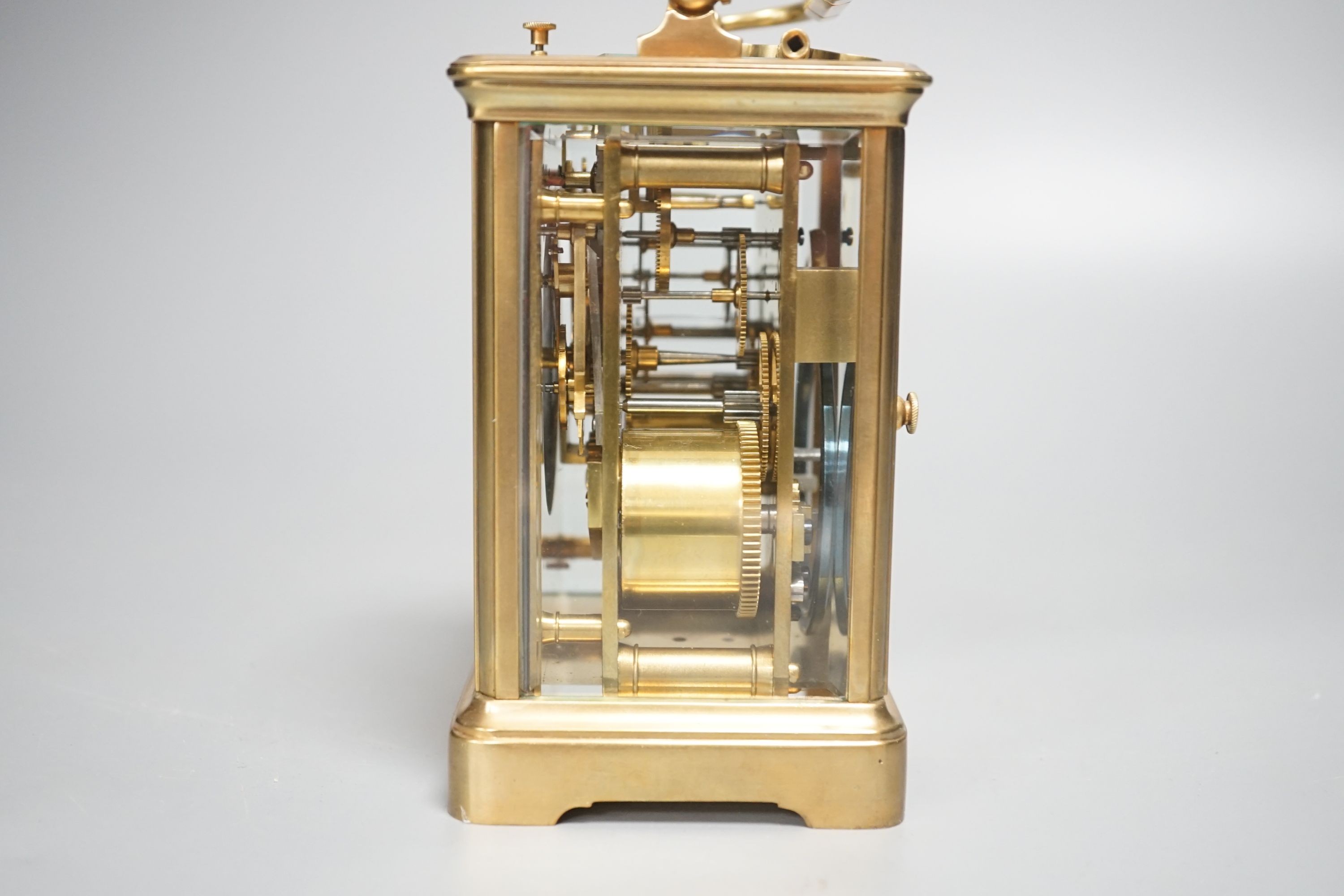 A brass repeating carriage clock, 13cm with key